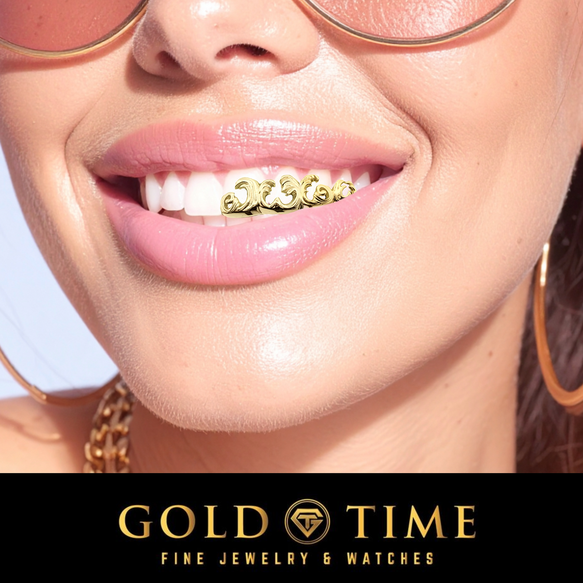 Close-up of a smiling woman wearing gold grillz on her teeth, with gold hoop earrings and round sunglasses visible. A black banner at the bottom reads 'GOLD TIME FINE JEWELRY & WATCHES'.