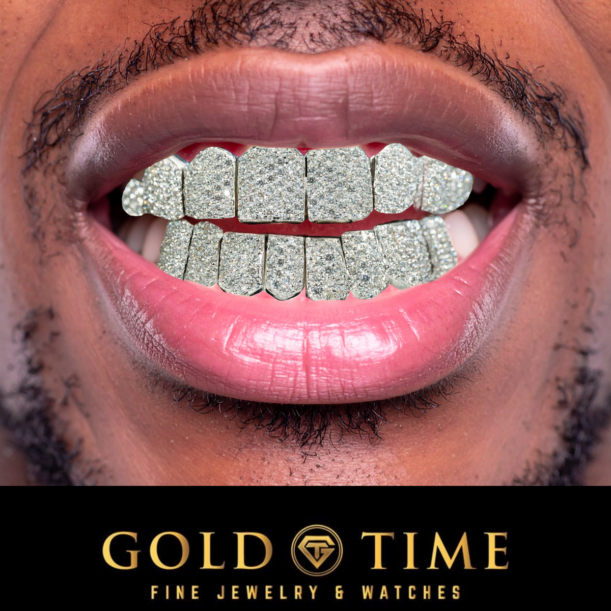 A close-up of a person's mouth wearing sparkling silver grillz on both upper and lower teeth, with visible lips, beard, and a black banner at the bottom reading 'GOLD TIME FINE JEWELRY & WATCHES'.