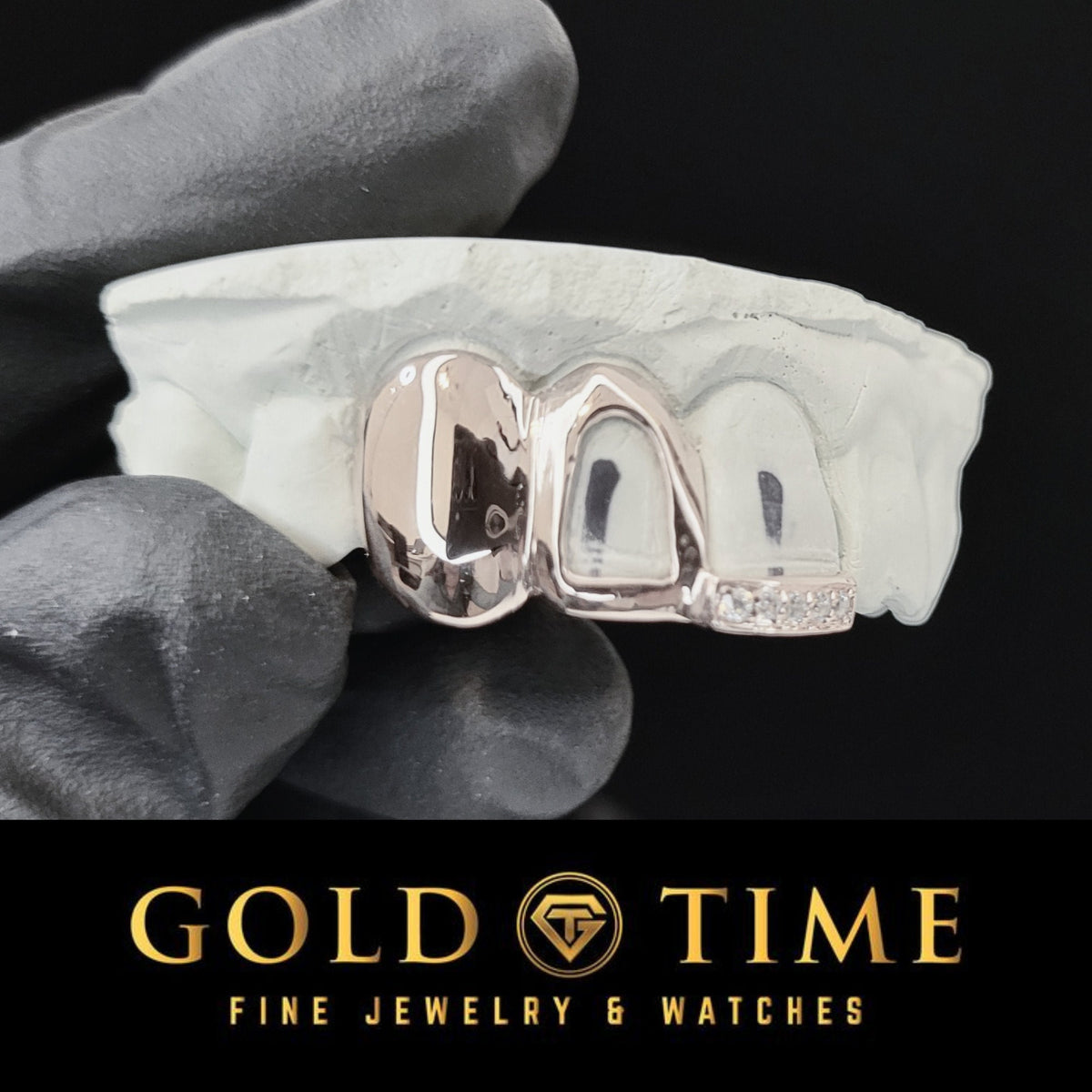 Silver grillz on a white stone with 'Gold Time' branding at the bottom.