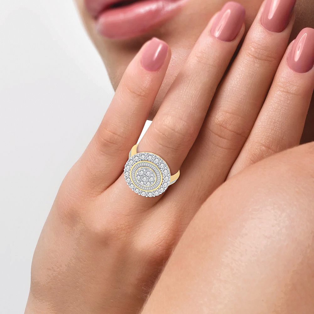 10K yellow gold round and baguette diamond cluster ring worn on the hand
