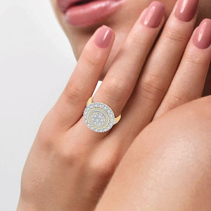 10K yellow gold round and baguette diamond cluster ring worn on the hand