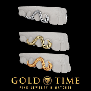 Custom snake grillz shown in white, yellow, and rose gold on three dental molds