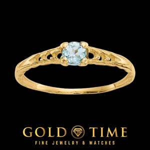 14k gold children's ring with a round pale blue aquamarine in a four prong setting