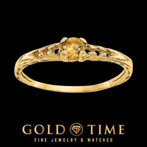 14k gold children's ring with a round golden citrine in a four prong setting