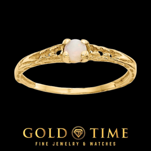 14k gold children's ring with a round white opal in a four prong setting