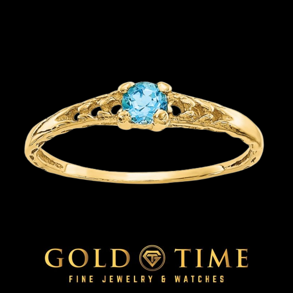 14k gold children's ring with a round bright blue Swiss blue topaz in a four prong setting