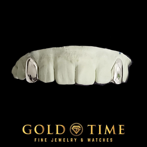 White gold 2 piece solid canine caps on a top dental mold