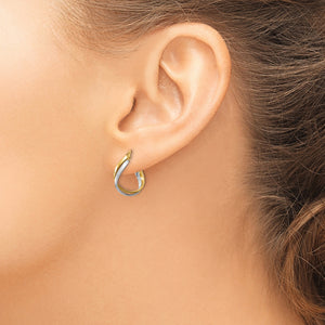 14K Two-Tone Gold Twisted Hoop Earrings in yellow and white gold, worn on the ear