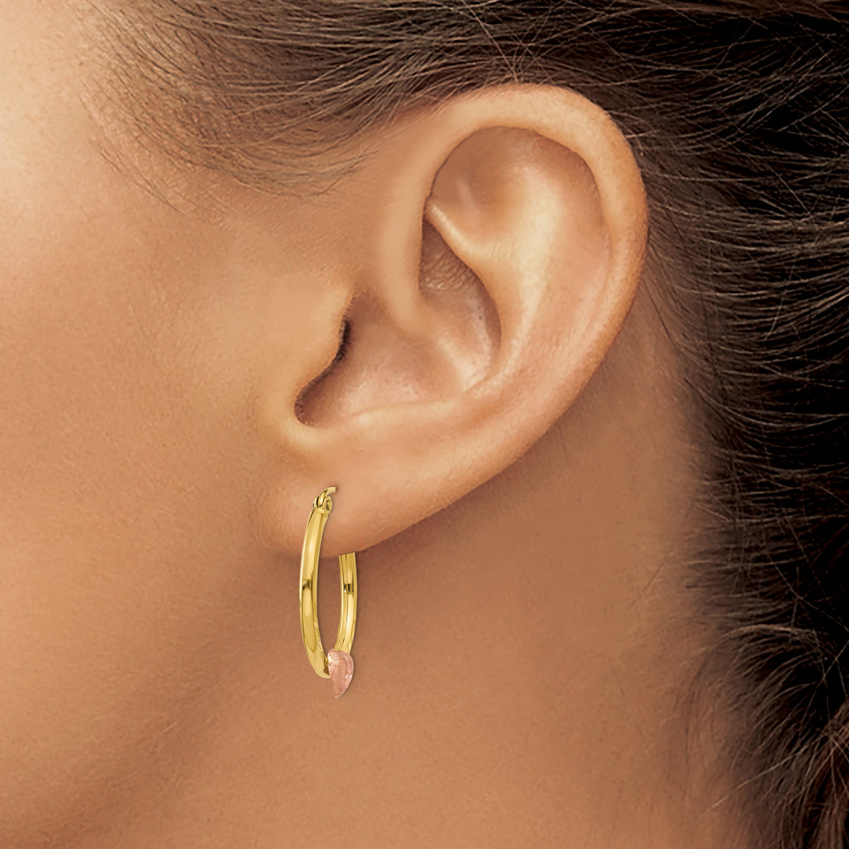 14K Yellow and Rose Gold Heart Hoop Earrings, 23mm, worn on the ear