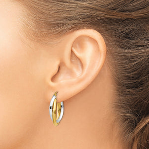 14K Two-Tone Gold Double Oval Hoop Earrings in yellow and white gold, worn on the ear