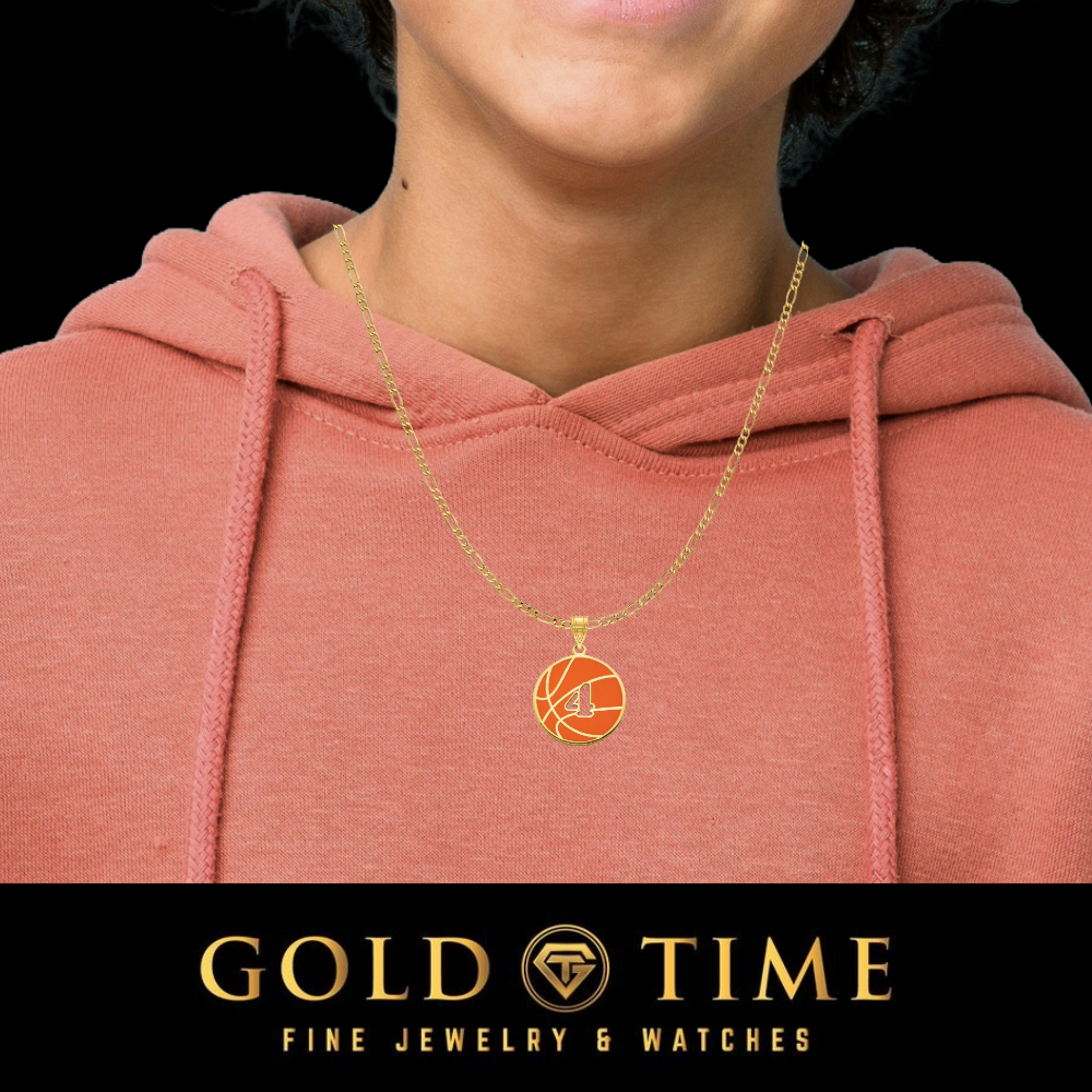 A gold chain necklace with a circular basketball pendant worn by a model in a dusty rose hoodie, with a black banner at the bottom reading 'GOLD TIME FINE JEWELRY & WATCHES'.