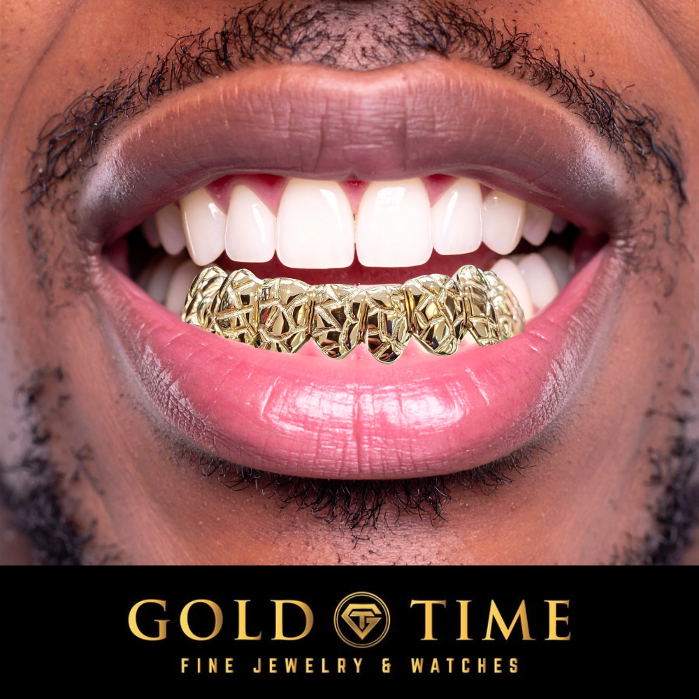 A man wearing an 8-piece gold nugget grillz
