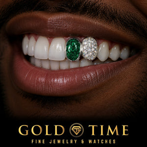 Smile wearing the custom 2 piece grillz: emerald stone cap on the lateral incisor and honeycomb moissanite cap on the canine, Gold Time