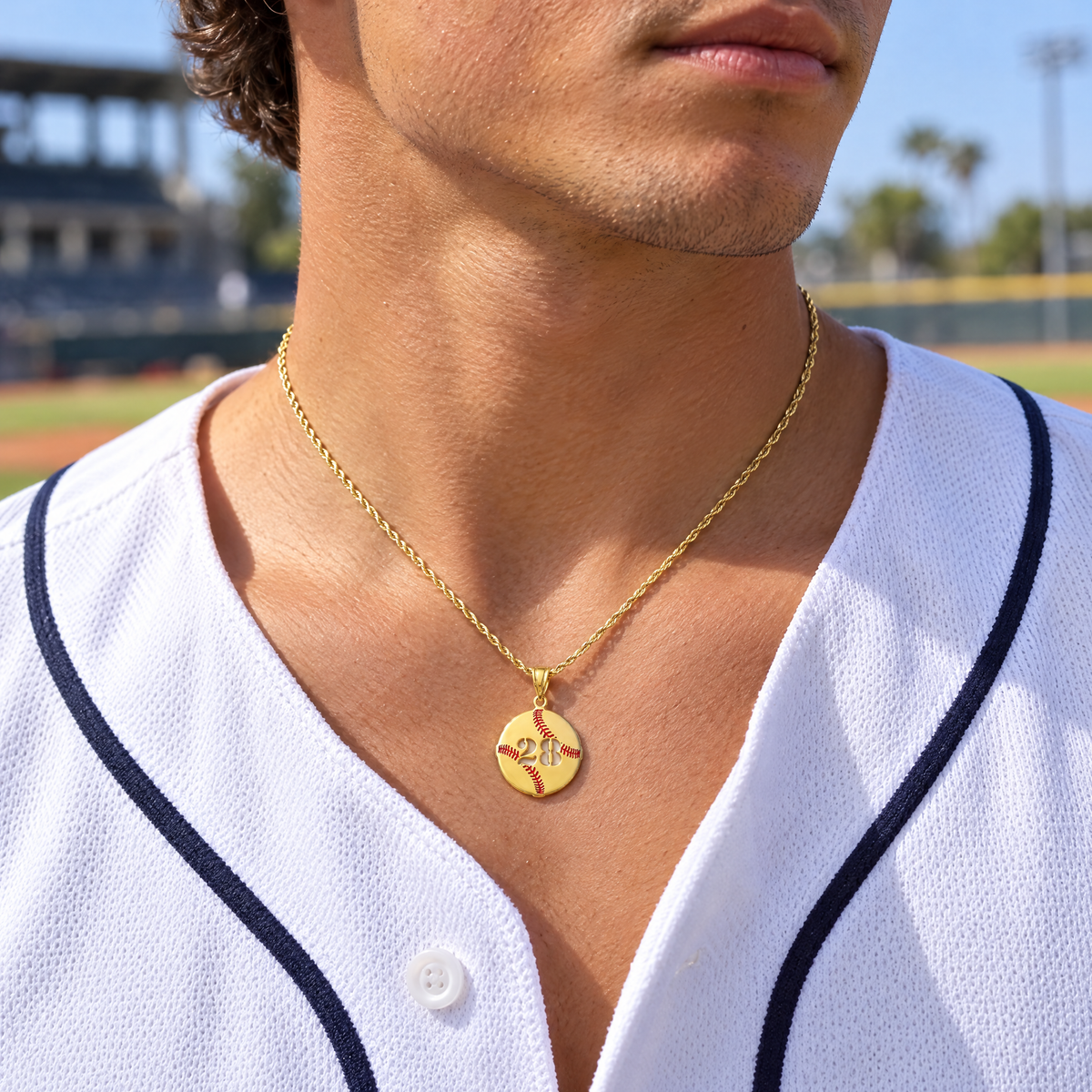 Yellow gold baseball number pendant with red enamel stitching and cutout 28, worn by a young man, lifestyle photo, Gold Time