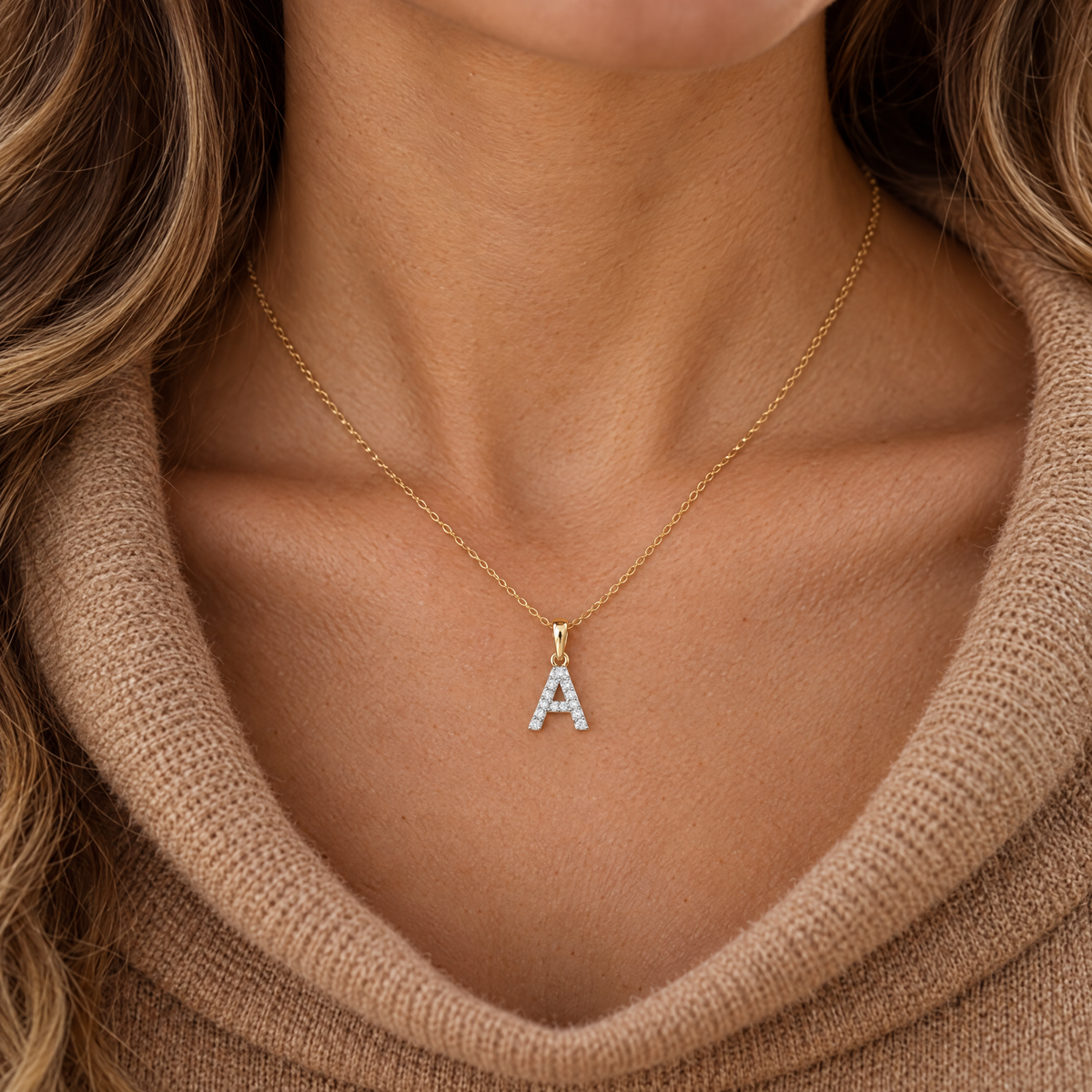 10K gold diamond initial A pendant worn on a fine chain by a woman, lifestyle photo, Gold Time