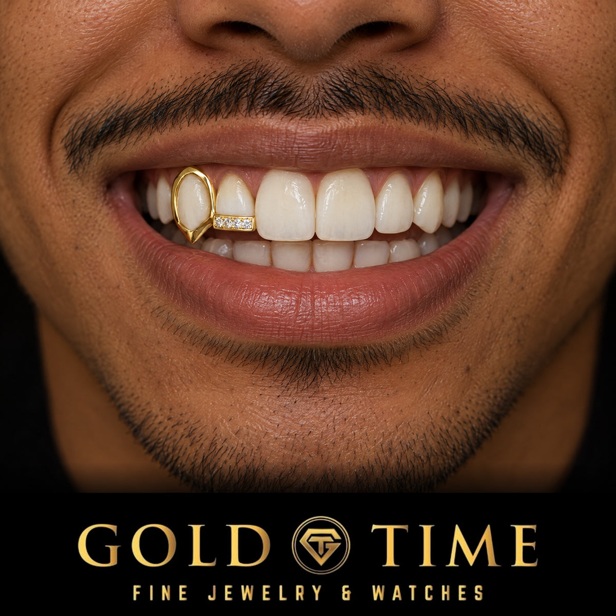 Man smiling in a yellow gold double cap grill with an open face canine fang and a moissanite tip on the incisor, Gold Time