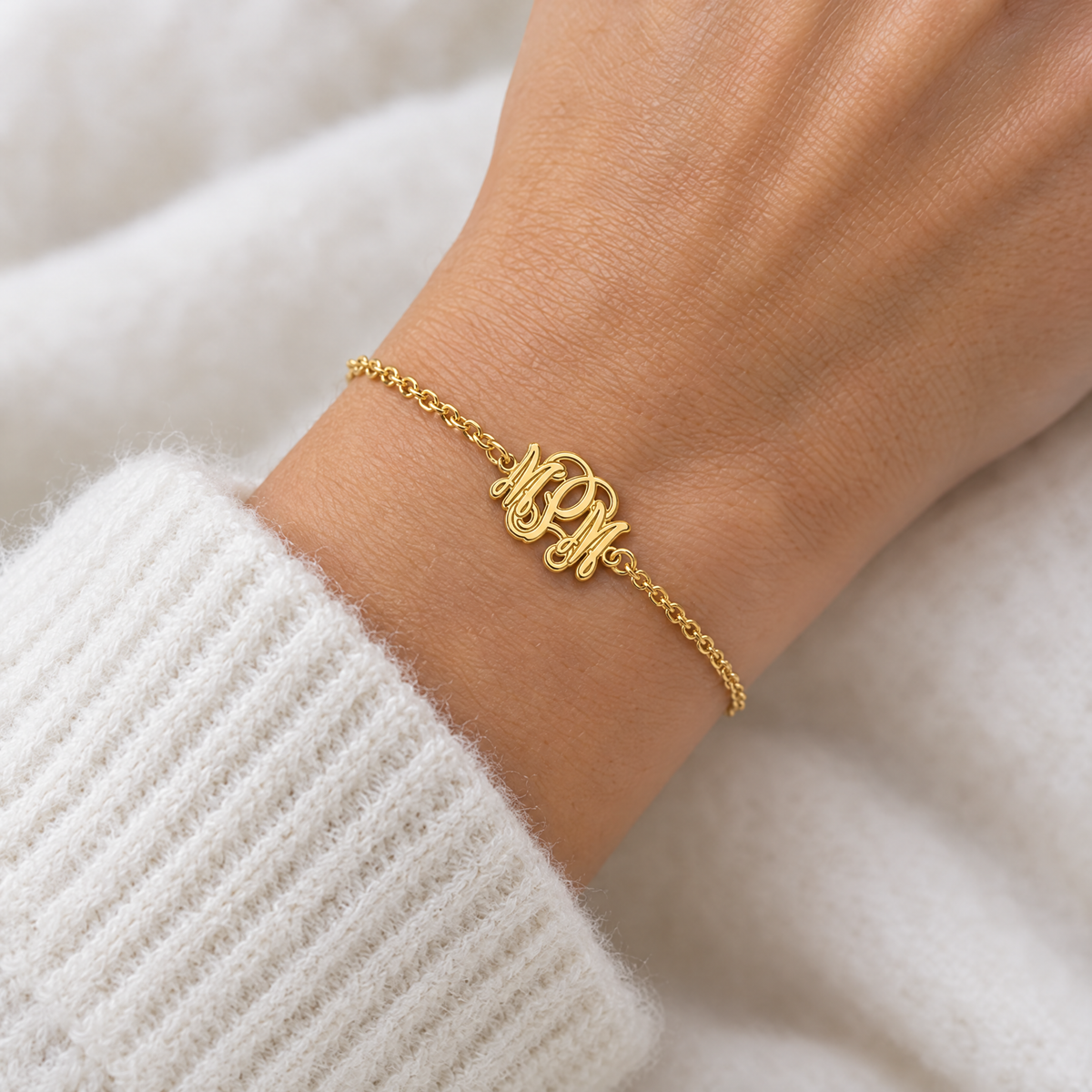 Yellow gold three initial script monogram bracelet worn on a woman's wrist, lifestyle photo, Gold Time