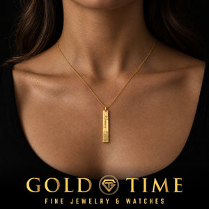 Woman wearing a yellow gold fingerprint and signature bar pendant on a fine cable chain, Gold Time