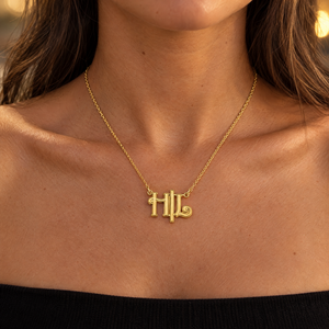 Gold plated two letter Gothic monogram necklace worn by a woman, lifestyle photo, Gold Time