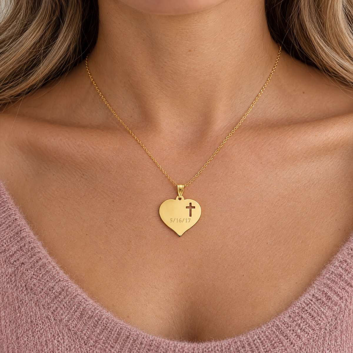 Gold plated heart pendant with a cross cutout and engraved date, worn by a woman, lifestyle photo, Gold Time
