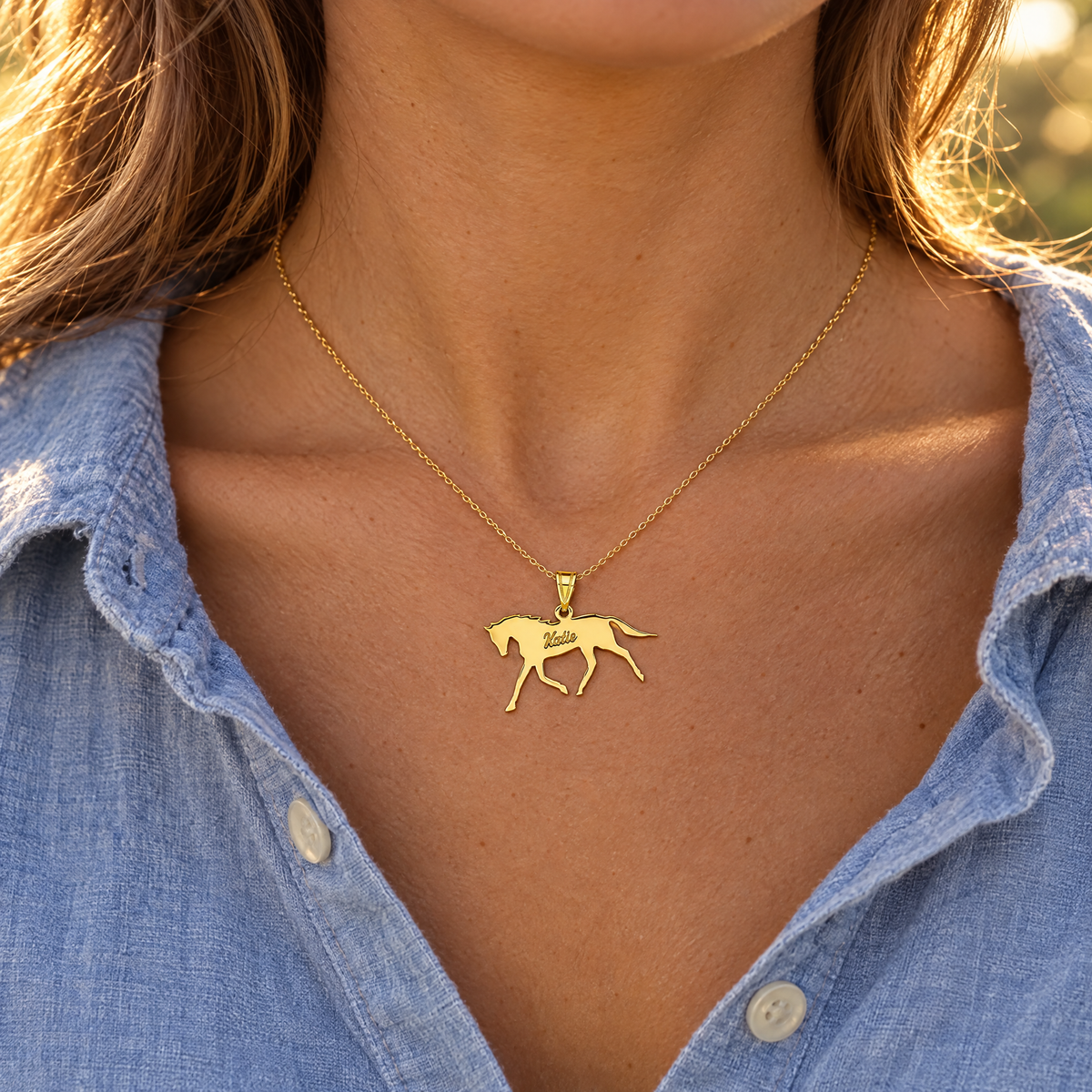 Yellow gold horse name pendant engraved Katie, worn on a fine chain by a woman, lifestyle photo, Gold Time