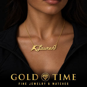 Woman wearing a large yellow gold Lauren name necklace with a runner image, Gold Time