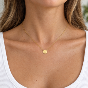 Yellow gold initial circle necklace with a block letter S, worn by a woman, lifestyle photo, Gold Time