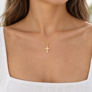 Yellow gold Latin cross pendant, 18mm, worn on a fine chain by a woman, lifestyle photo, Gold Time