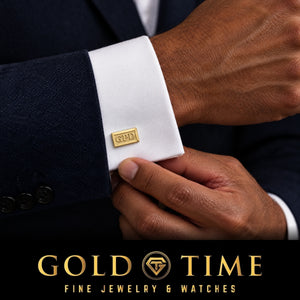 Man in a navy suit wearing a yellow gold rectangle monogram cufflink with raised initials, Gold Time