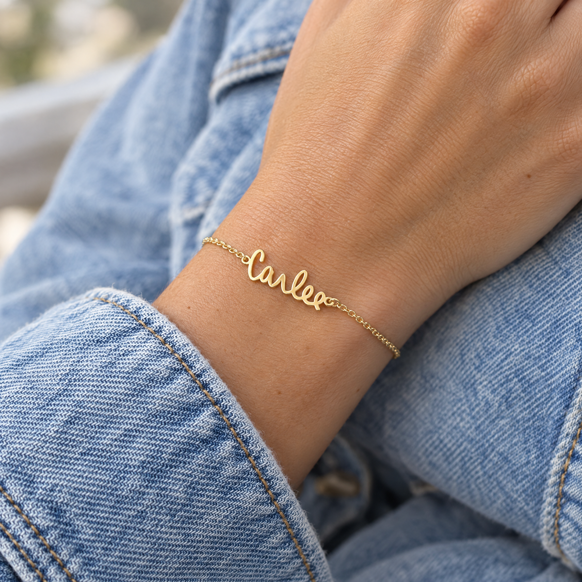 Yellow gold signature name bracelet reading Carlee, worn on a woman's wrist, lifestyle photo, Gold Time