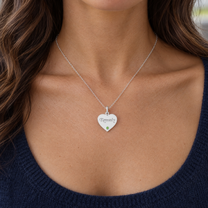 Sterling silver heart pendant engraved Kennedy with a green birthstone, worn by a woman, lifestyle photo, Gold Time