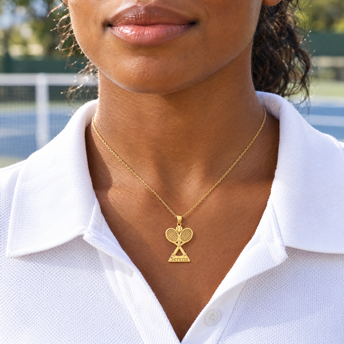 Yellow gold tennis racket name pendant reading Serena, worn by a woman tennis player, lifestyle photo, Gold Time