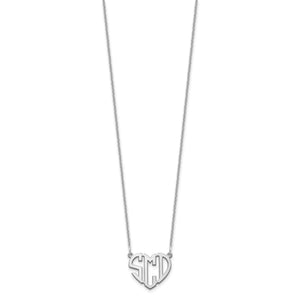 Heart monogram pendant measured against a ruler at about half an inch across