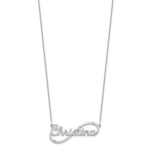 Yellow gold infinity name necklace beside a ruler showing the pendant measures about 1.5 inches wide