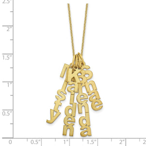 Yellow gold necklace with four vertical brushed name charms against an inch scale for size reference