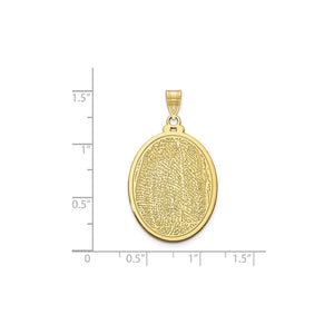 Yellow gold oval fingerprint pendant against an inch scale, about 29mm by 21mm