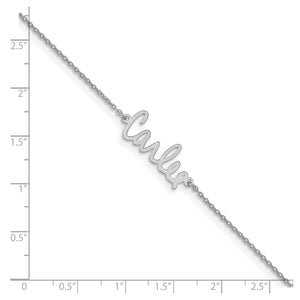 White signature name bracelet next to a ruler showing the size of the name