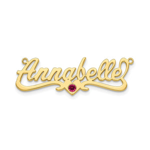 Yellow gold Annabelle script nameplate with a red birthstone below the name