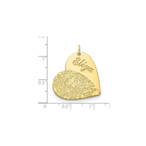 Fingerprint and name heart pendant measured against a ruler at about three quarters of an inch