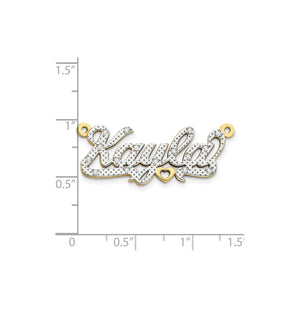 3D diamond Kayla nameplate measured against a ruler at about three quarters of an inch tall