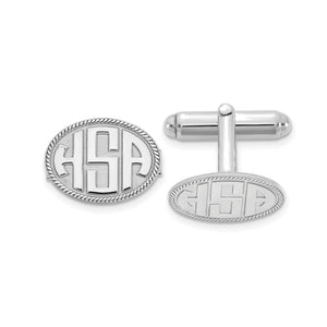 White oval cuff links with a raised three-letter monogram and rope border