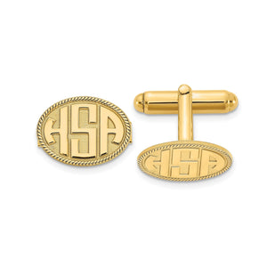 Yellow oval cuff links with a raised three-letter monogram and rope border