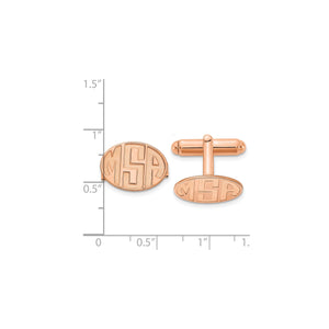 Rose plated oval monogram cuff links beside a ruler for scale