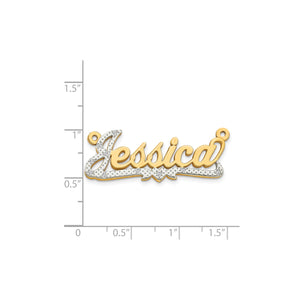 Two tone diamond Jessica nameplate measured against a ruler at about one inch tall