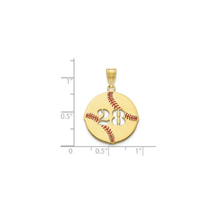 Yellow gold baseball number pendant next to a ruler for scale