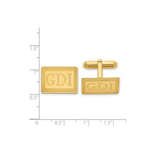 Yellow gold rectangle monogram cuff links next to a ruler for scale