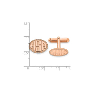 Rose rope border monogram cuff links against an inch ruler