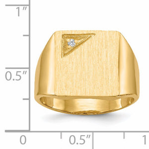 Men's gold signet ring beside a ruler showing the top measures about half an inch across