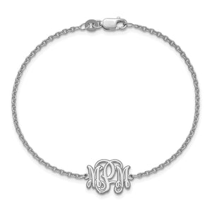 White monogram bracelet laid in a circle with the lobster clasp at the top