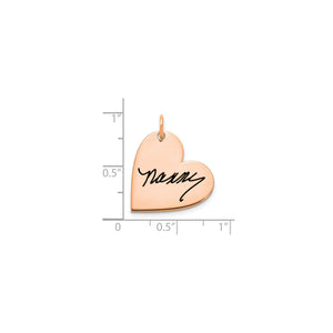 Rose gold signature heart pendant measured against a ruler at about three quarters of an inch